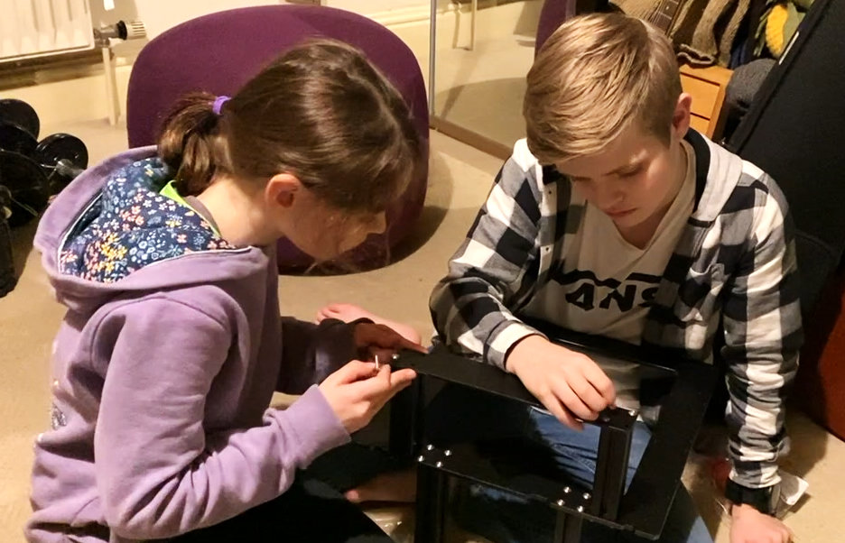 kid building a 3d printer